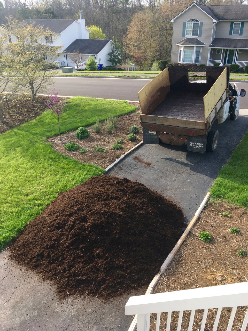 truck load of mulch in driveway
